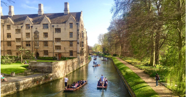 Punting on the river beside Cambridge college